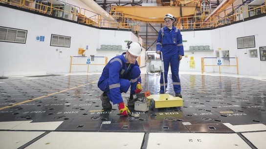 Male and Female engineers measuring radiation