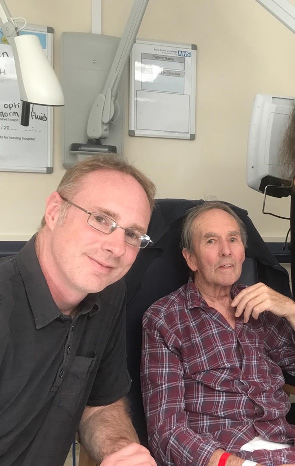 Employee and his dad smiling