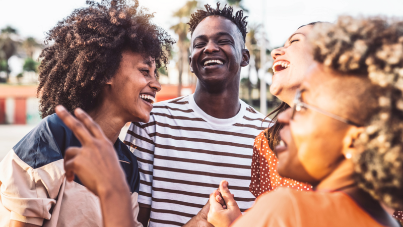 Group of friends laughing outside