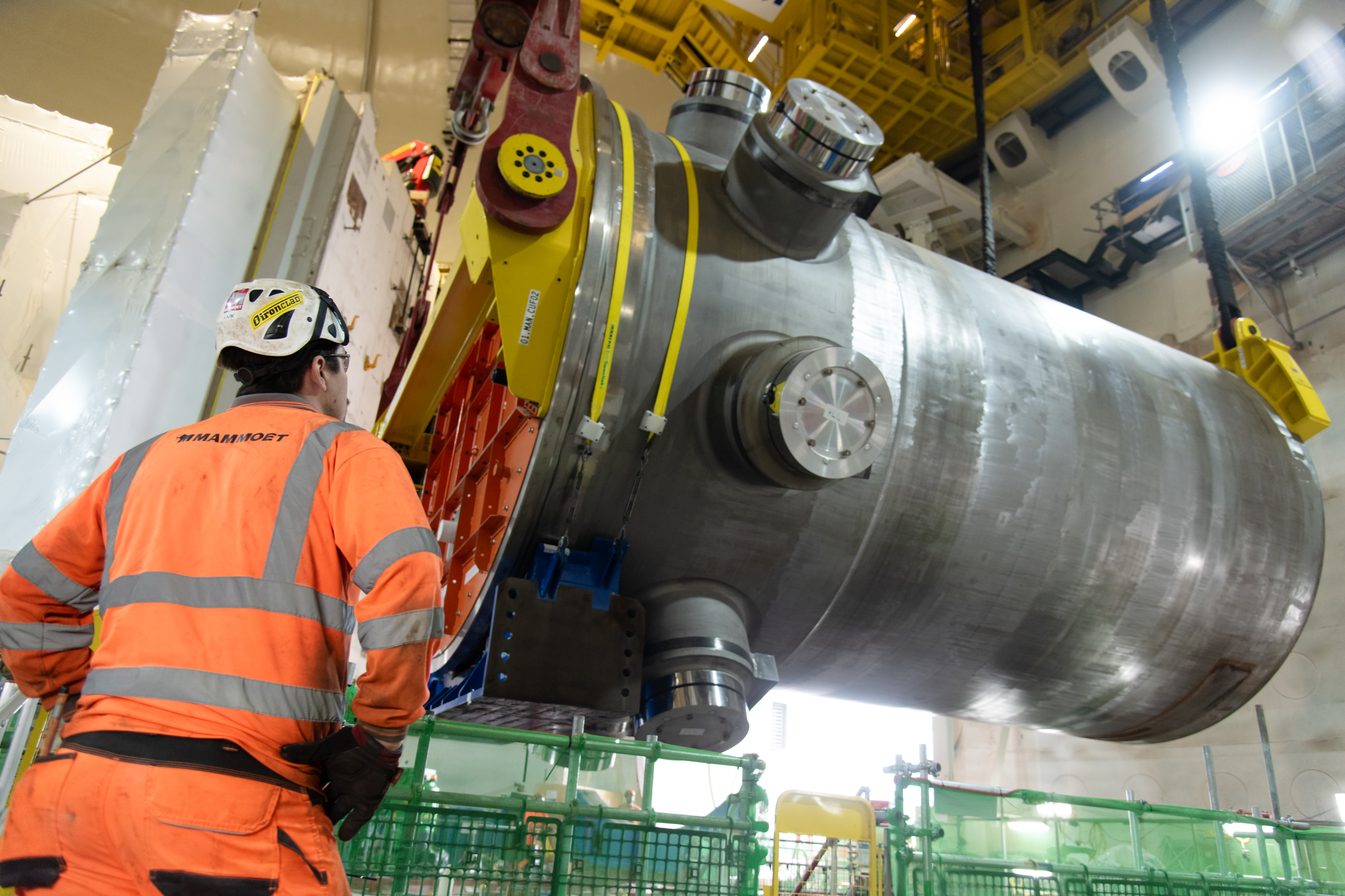 The polar crane carefully lowered the reactor into place inside the building.