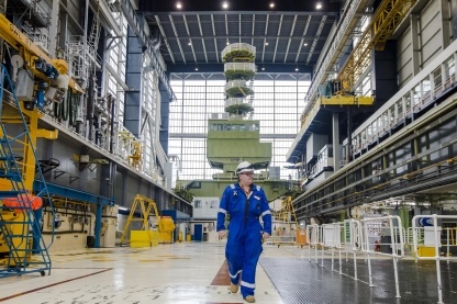 Male nuclear worker walking through the charge hall at Hunterston B