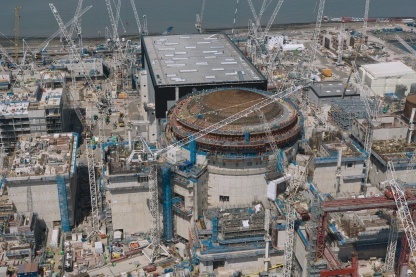 Aerial image showing Unit 1 reactor with colleagues visible on the Dome completing its concrete containment.