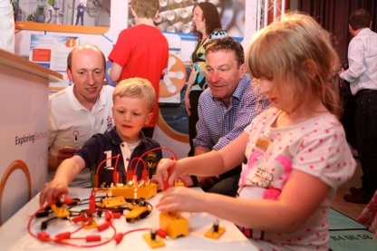 Children interacting with experiments on the EDF Energy stand at The Times Cheltenham Science Festival