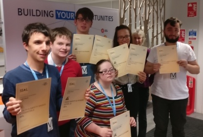 Trainees celebrate their latest achievements as part of the course.