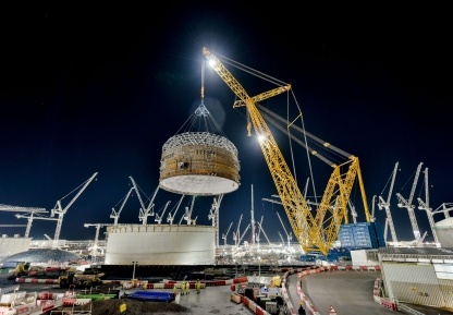 The super-crane lifted a total weight of 575 tonnes to install the first of three massive prefabricated steel rings which form the reinforced cylinder around the nuclear reactor.