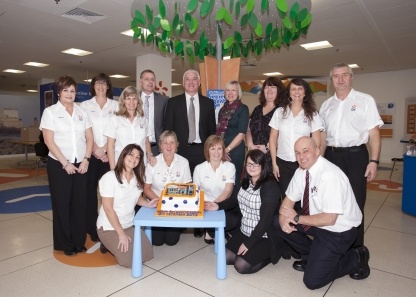 EDF Energy Visitor Centre staff celebrate with Hinkley B's Peter Evans, Hinkley C construction director Nigel Cann and Shelly Mitchinson from the company's customer services team.