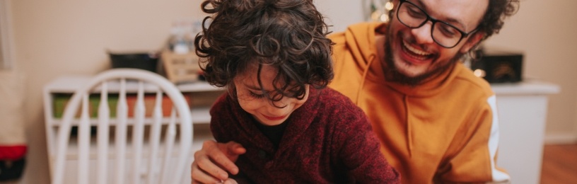 Family looking at laptop.