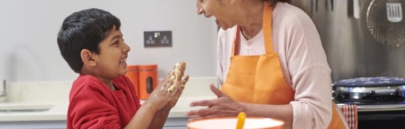 Mother and son cooking in the kitchen