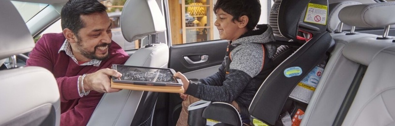 Man and young boy in EV