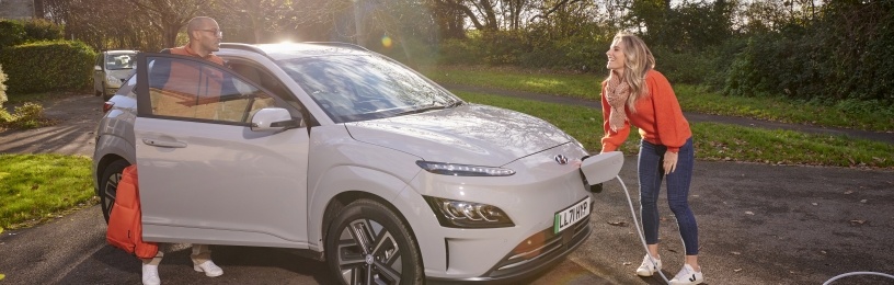 Grey EV beeing charged