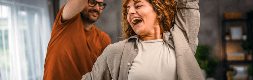 A couple dancing happily