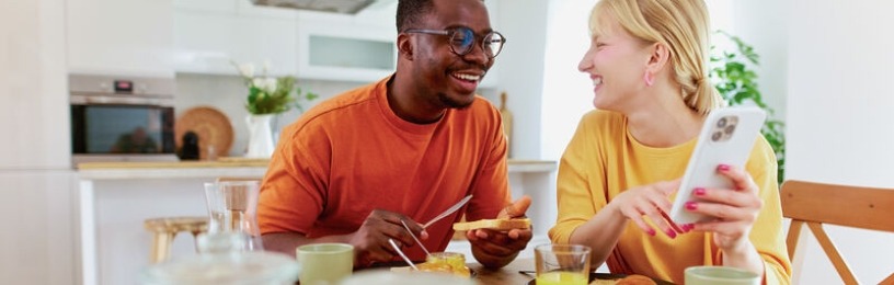 Friends talking in a bright sunny kitchen