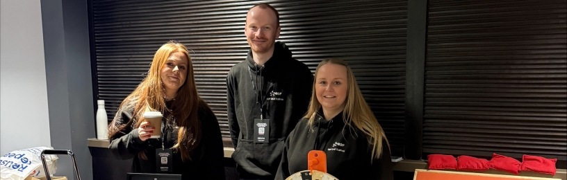 EDF small business reps standing by EDF display at Expo