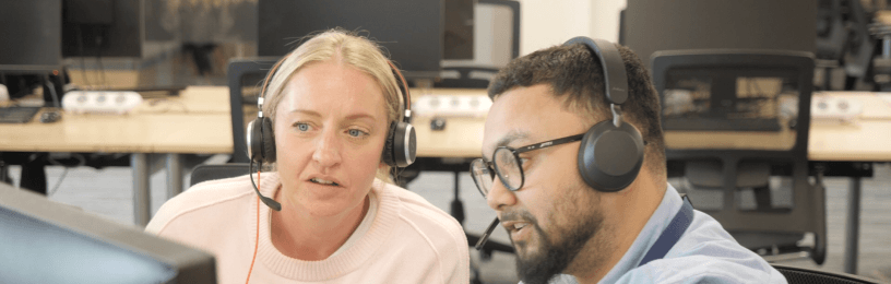 Small business energy specialists looking at screen