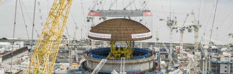The world’s largest crane, “Big Carl” lifts the 245-tonne dome onto the second reactor building 