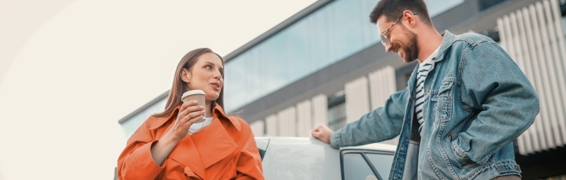 Friends charging EV while talking