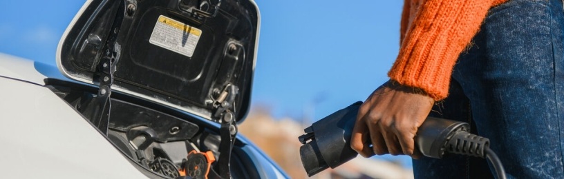 Person plugging in EV