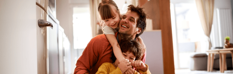 Family playing on kitchen floor