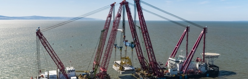 The 5,000 tonne structure being lowered is the second of four “intake” heads being connected to 5 miles of tunnels, which will supply Hinkley Point C’s two nuclear reactors with cooling water.