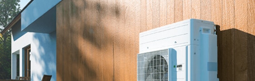 hybrid heat pump on the side of a modern house