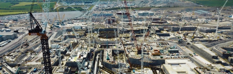 The view south across the Hinkley Point C Construction Site showing the main excavations and pipework for the cooling water systems of unit 1.