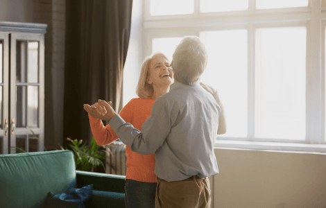 Couple dancing in their living room