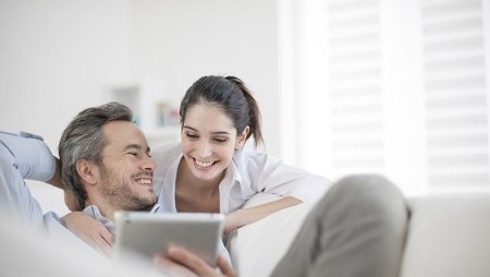 Couple looking at a laptop together