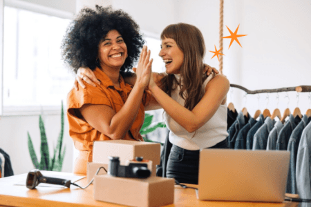 Two people high fiving
