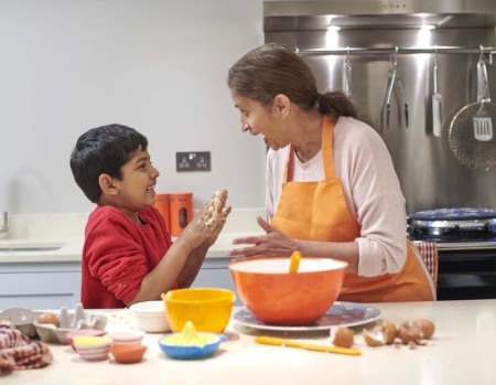 Mother and son cooking in the kitchen