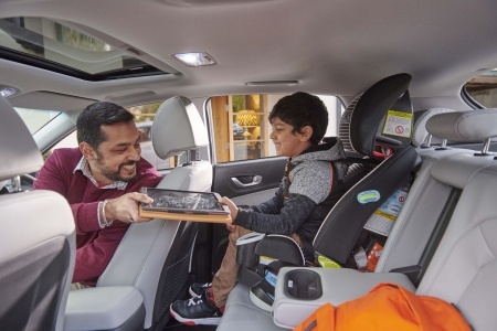 Man and young boy in EV