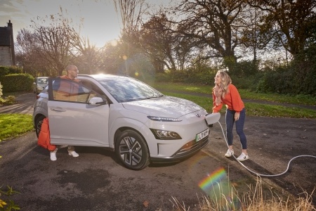 Grey EV beeing charged