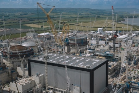Aerial image showing Unit 1’s fully clad Turbine Hall in the foreground.