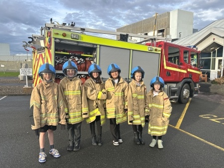 School Children standing in front of a fire engine at Torness power station