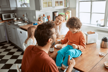 A family enjoying breakfast in a kitchen