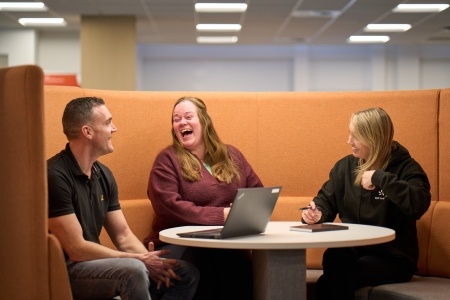 Group of EDF Customer employees speaking and laughing