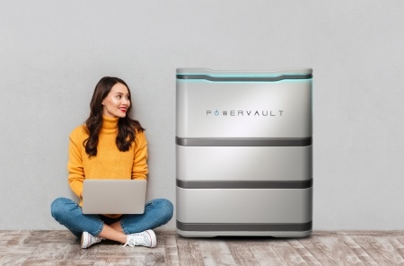 Lady with laptop next to Powervault