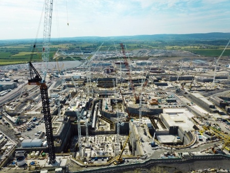 The view south across the Hinkley Point C Construction Site showing the main excavations and pipework for the cooling water systems of unit 1.