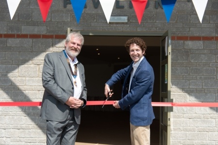 Andrew Cockcroft, Senior Community Relations Manager at Hinkley Point C and Derek Bradley-Balmer, the Chair of Cheddar Parish Council, cut the ribbon on the refurbished Cheddar Community Pavilion
