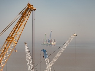 Two massive jack up vessels have been installing vital elements for the power station’s cooling water system - including vertical shafts which will connect the tunnels with the intake and outtake heads.