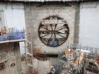 The equipment hatch is ready for its cover to be installed. The hatch will open and close, allowing equipment to be moved into the reactor building during construction and operation.