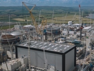 Aerial image showing Unit 1’s fully clad Turbine Hall in the foreground.