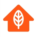 Orange house icon with leaf icon in it