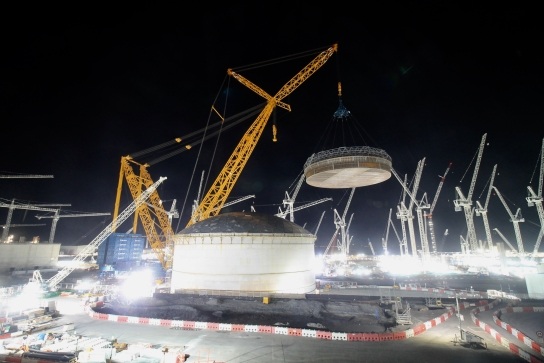 Image showing 'Big Carl' the crane lifting one of the rings into place.