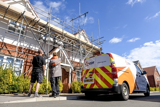 EDF Installer speaking to customer about a solar panel installation