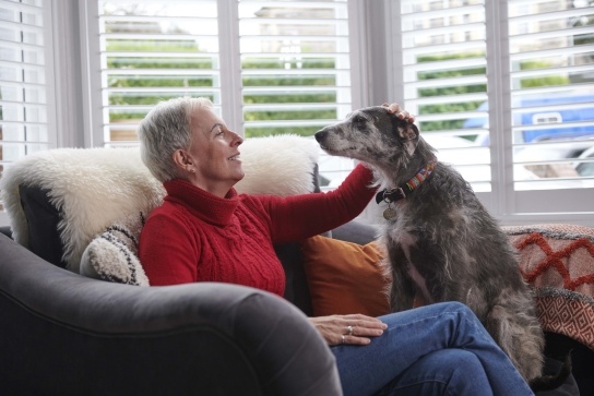 Lady on chair with her dog