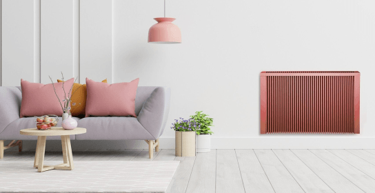 Pink electric radiator in stylish living room 