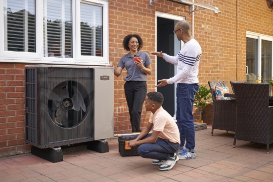 Installer showcasing a heat pump