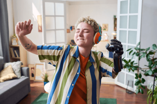 Person dancing listening to music through headphones