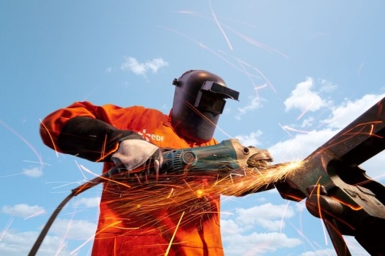 EDF engineer working with an angle grinder