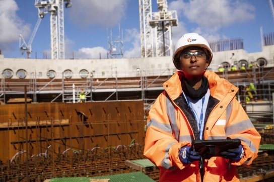 Engineer standing at Hinkley Point C nuclear power plant